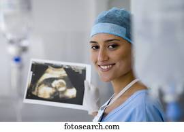 Female doctor holding sonogram