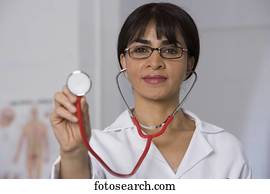 Female doctor holding up stethoscope