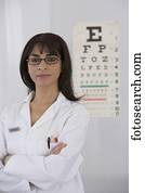 Female doctor in front of eye chart
