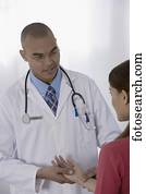 Male doctor examining patient