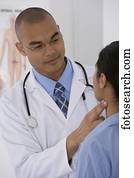 Male doctor examining patient