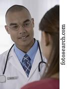 Male doctor talking to patient