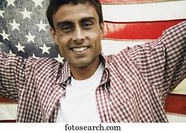 Man holding up American flag