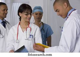 Multi-ethnic doctors discussing chart