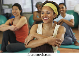Multi-ethnic women in yoga class