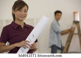 Asian couple renovating house