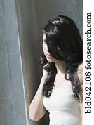 Hispanic woman with long hair