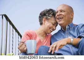 Senior African American couple hugging 