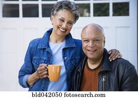 Senior African American couple hugging