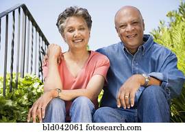 Senior African American couple hugging