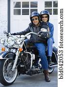 Senior African American couple on motorcycle