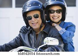 Senior African American couple on motorcycle