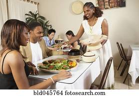 African American couple eating at restaurant