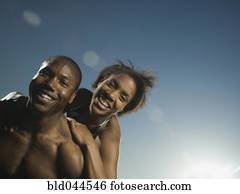 African American couple hugging