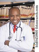 African American male doctor with arms crossed