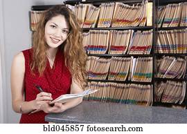 Hispanic female medical professional holding chart