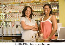 Multi-ethnic female sales clerks at perfume store