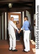 African American couple entering house