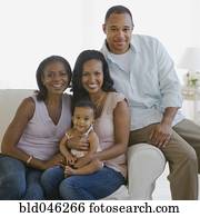 Multi-generational African American family on sofa