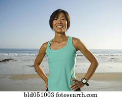 Asian woman with hands on hips