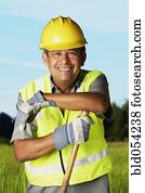 Hispanic man wearing hard hat and reflective vest