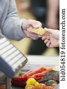 Man paying with credit card at grocery store