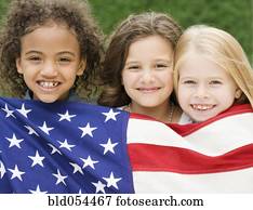 Multi-ethnic girls holding American flag