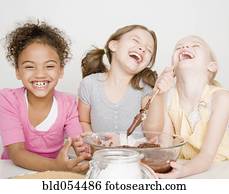 Multi-ethnic girls making batter
