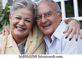 Senior Hispanic couple hugging Senior Hispanic couple hugging