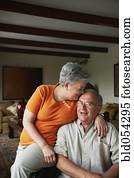 Senior Hispanic couple hugging