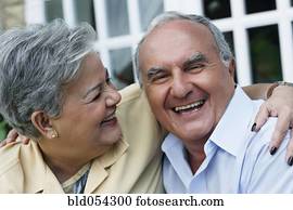 Senior Hispanic couple laughing