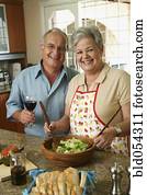 Senior Hispanic couple preparing food Senior Hispanic couple preparing food