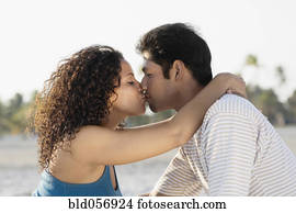 Hispanic couple kissing