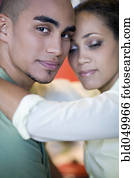 African American couple hugging