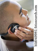 African American man listening to headphones
