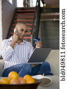 African American man shopping online