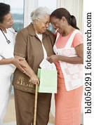 African American mother and adult daughter touching foreheads
