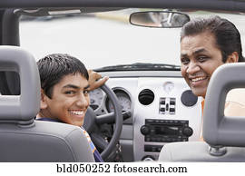 Middle Eastern father and son in new car
