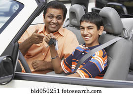 Middle Eastern father and son in new car
