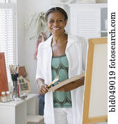 Senior African American woman painting