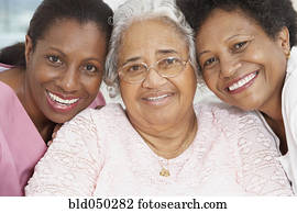 Senior African American woman with nurse and daughter