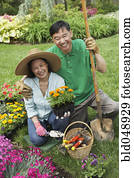 Senior Asian couple gardening