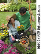 Senior Asian couple gardening
