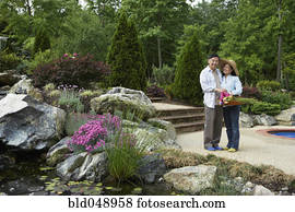 Senior Asian couple in garden Senior Asian couple in garden