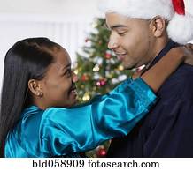 African couple hugging