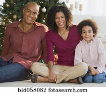 African family in front of Christmas tree