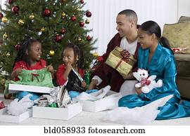 African family opening Christmas gifts