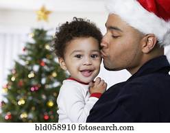 African father kissing baby