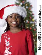 African girl wearing Santa Claus hat