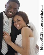 African newlyweds hugging